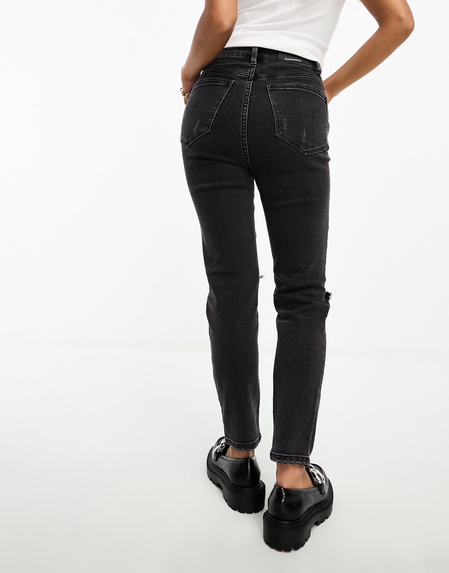 Stradivarius Petite slim mom jean with stretch and rip in washed black