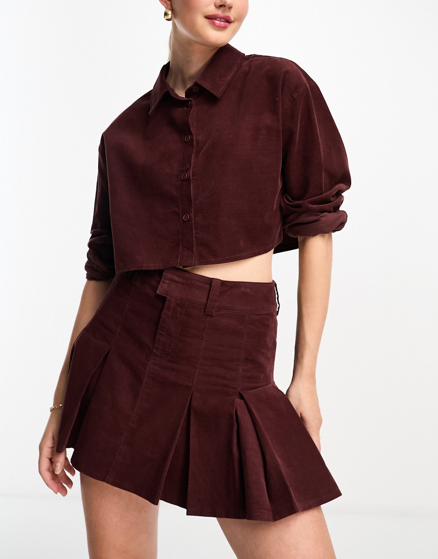 ASOS DESIGN cord pleated mini skirt in burgundy