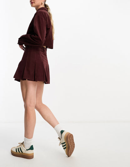 ASOS DESIGN cord pleated mini skirt in burgundy