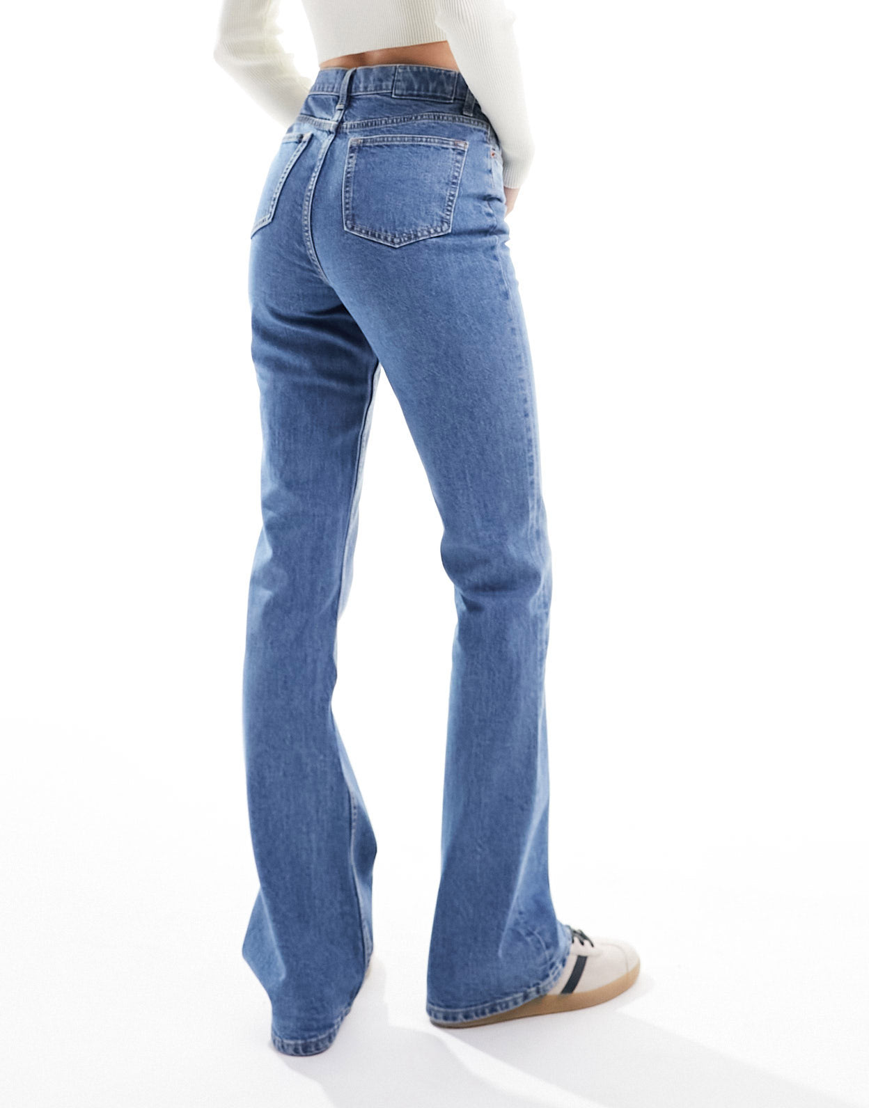 ASOS DESIGN Tall flared jeans in mid blue